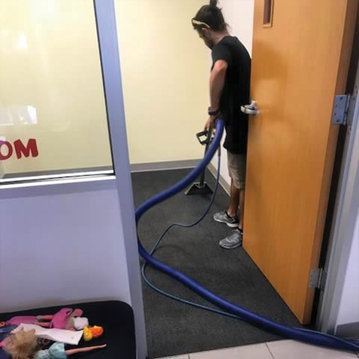 Worker Performing Commercial Carpet Cleaning Service for Aurora, CO and Denver, CO Company