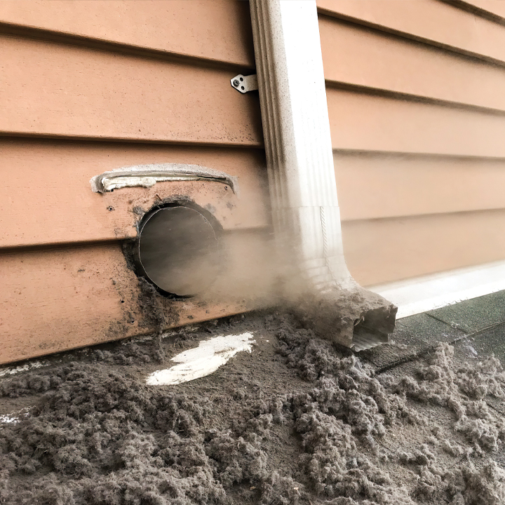 Blowing Out Debris During a Dryer Duct Cleaning Project Near Lakewood, CO